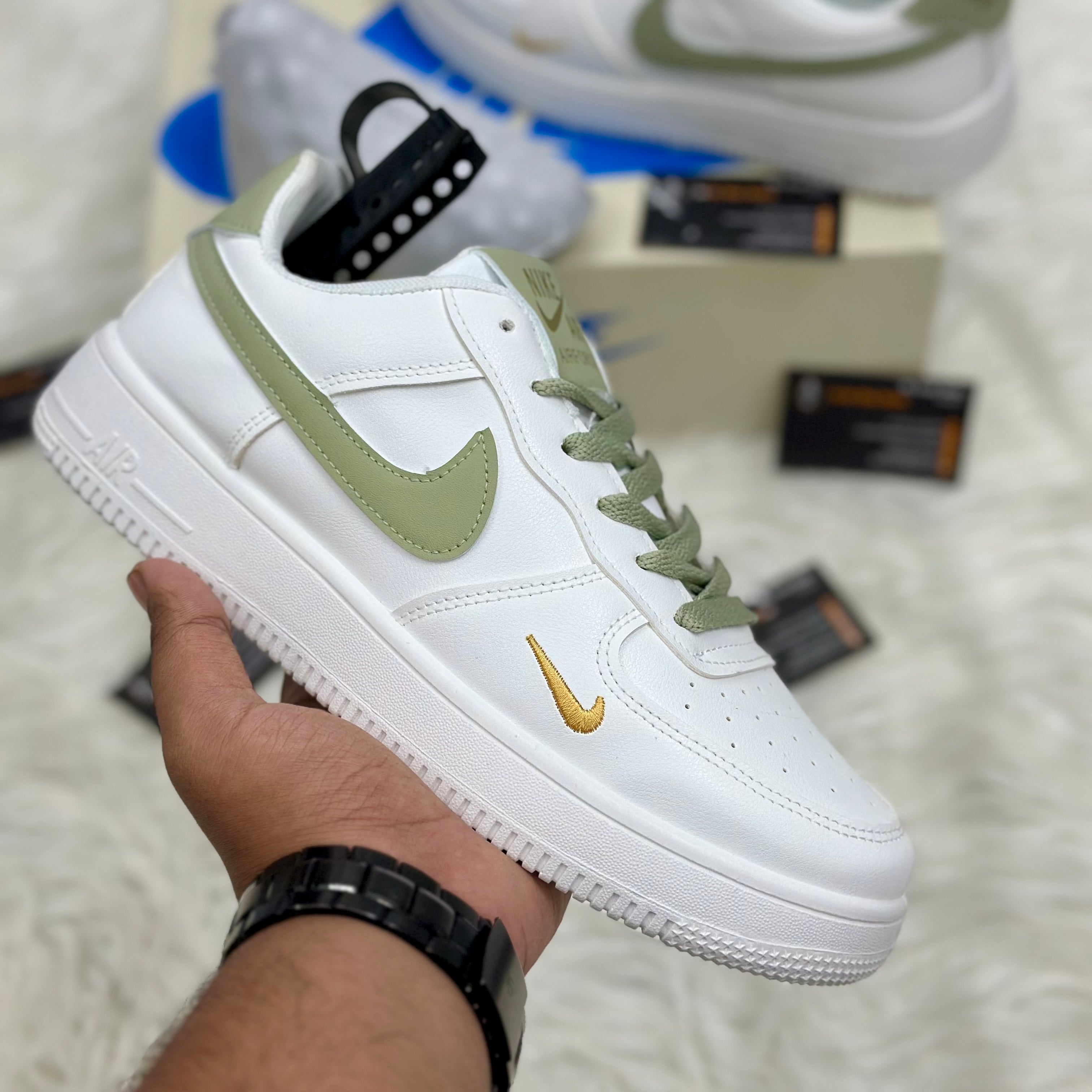Nike Air Force 1 ’07 LV8 “Mini Swoosh” — White/Light Olive/Metallic Gold.