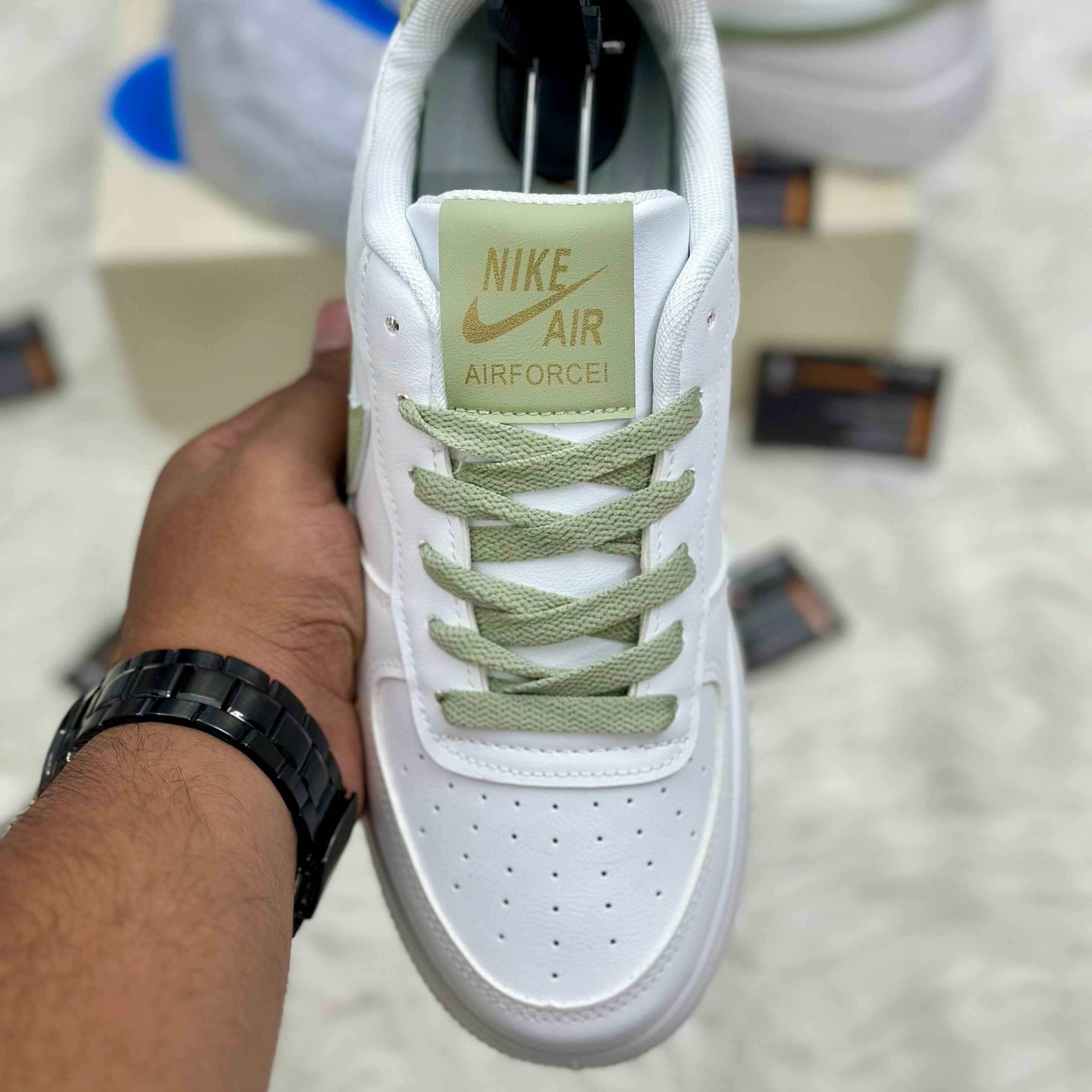 Nike Air Force 1 ’07 LV8 “Mini Swoosh” — White/Light Olive/Metallic Gold.